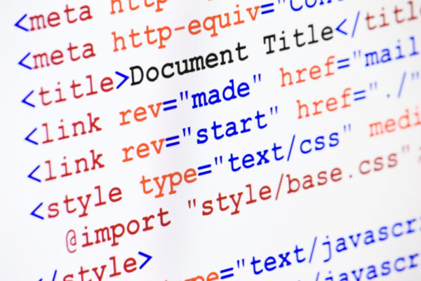 HTML web page source code with document title Web page HTML source code with document title, metadata description and links monitor screenshot diagonal view, small depth of sharpness